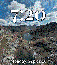 Alpine photo with a large serif clock and long date